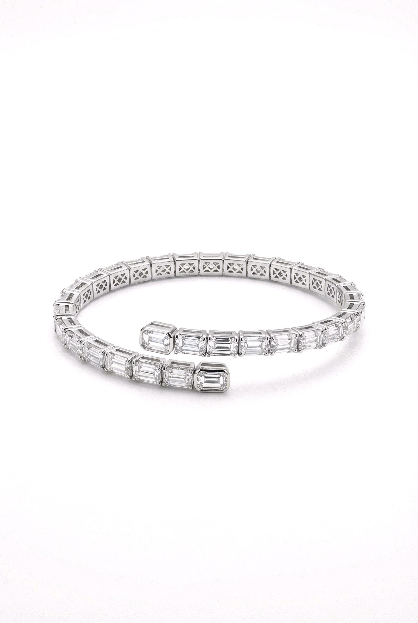 Silver bracelet with diamond accents on a white background